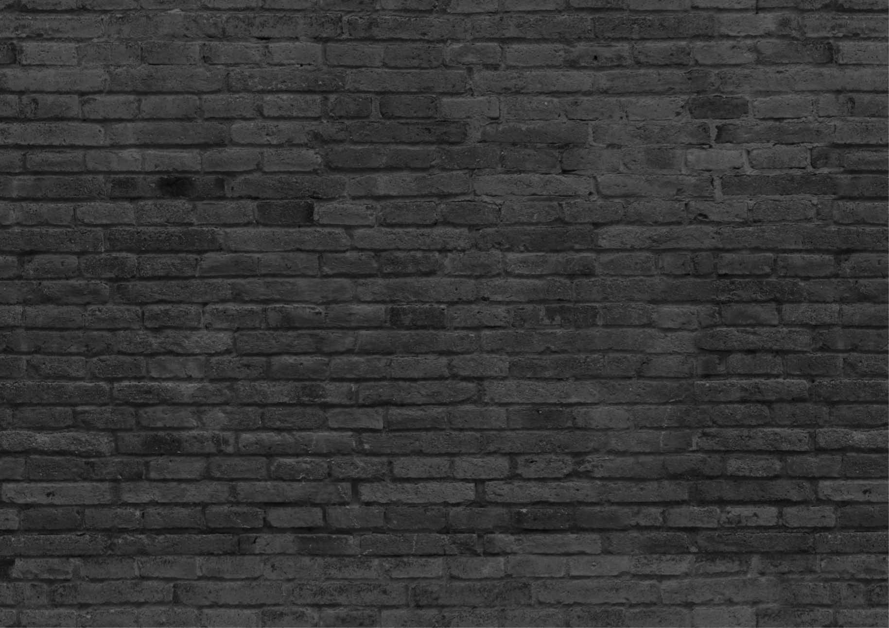 Part of black painted brick wall, horizont.