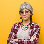 Young hippie natural woman crossing arms, smiling and relaxed